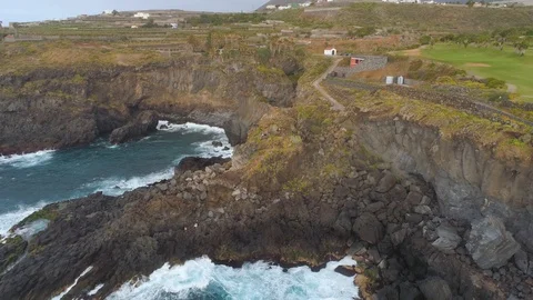Aerial view of cliffs and Atlantic ocean on Tenerife, drone shot from above Stock Footage 97713591