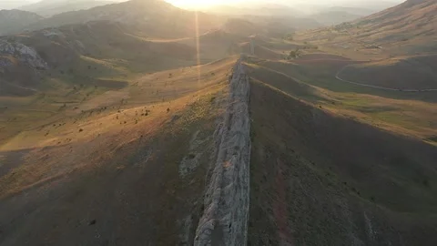 Aerial view of cliffs and mountains at sunset 2 Stock Footage 294103102