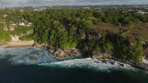 Aerial View of Cliffs and Ocean Waves at Balangan Beach, Bali Video stock 337606945