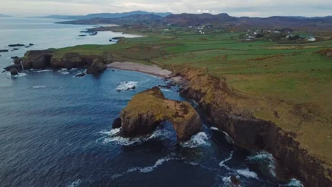 Aerial view of cliffs with arch in ocean in Fanad, Ireland Stock Footage 90084050
