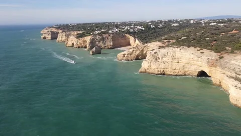 Aerial view of cliffs, arches and caves of the Marinha Beach Stock Footage 167783727