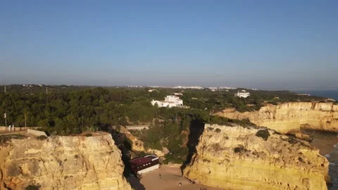 Aerial view of cliffs, arches and caves of the Marinha Beach Stock Footage 167783788