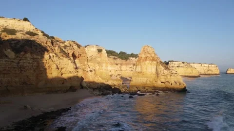 Aerial view of cliffs, arches and caves of the Marinha Beach Stock Footage 167783827