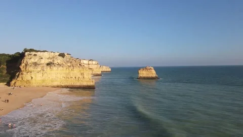 Aerial view of cliffs, arches and caves of the Marinha Beach Stock Footage 167783961