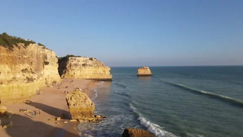 Aerial view of cliffs, arches and caves of the Marinha Beach Stock Footage 167784012