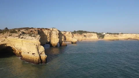 Aerial view of cliffs, arches and caves of the Marinha Beach Stock Footage 167784136