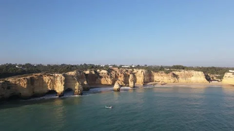 Aerial view of cliffs, arches and caves of the Marinha Beach Stock Footage 167784184