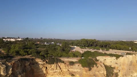 Aerial view of cliffs, arches and caves of the Marinha Beach Stock Footage 167784185