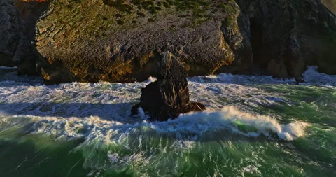 Aerial view of the cliffs of the famous Cabo da Roca are washed by the huge Stock Footage 308962202