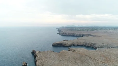 Aerial view of cliffs on the island of Menorca Stock Footage 120945157
