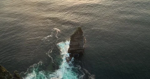 Aerial view of the Cliffs of Moher and Branaunmore sea stack in Ireland Stock Footage 343372385