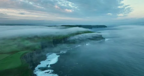 Aerial View of Cliffs of Moher Shrouded in Fog at Sunrise, Ireland Stock Footage 340139854