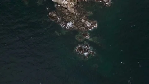 Aerial view of the cliffs by the sea on a cloudy day Stock Footage 162623194