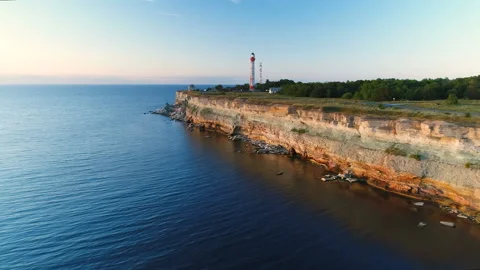 Aerial view the cliffs on the seaside overlooking the lighthouse Stock Footage 87420686