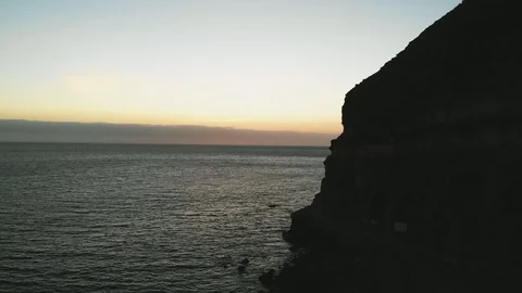 Aerial view from the cliffs at sunset on an island in the Atlantic Ocean - shot Stock Footage 108566370