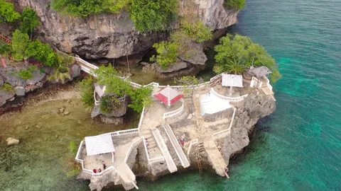 Aerial view of cliffside seaside structure above clear water, Philippines Stock Footage 325217678