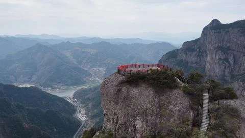 Aerial view of a cliffside viewing platform with red railings and stairs in Stock Photos