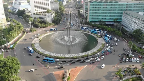 Aerial view clip of Selamat Datang monument statue or Bundaran HI Stock Footage 104906207