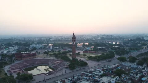 Aerial view of the Clock Tower in Lucknow, with the first light of day Stock Footage 299250059