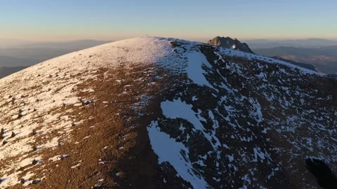 Aerial view, close flight over a snow-covered round mountain, mountain scenery Stock-Footage 305987066