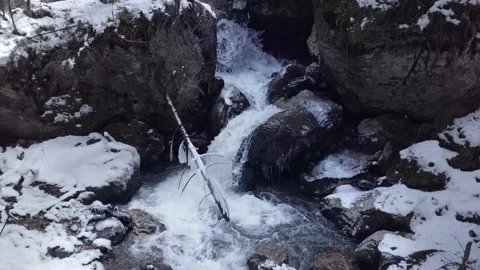 Aerial view close up on mountain waterfall. Drone flys back Stock Footage 153958606