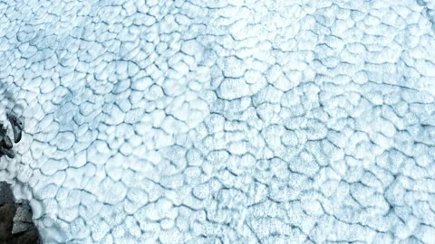Aerial View Close-up Texture of a Snow Surface in the Mountains. Icy Blue Arctic Stock Footage 136222798