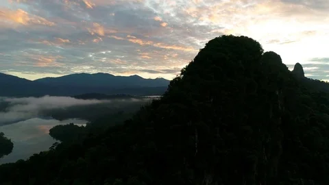 Aerial view. A close up view of hill peak during sunrise. 動画素材 83434189