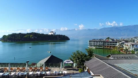 Aerial view of close view lake center small island surrounding village lawn lake Stock Footage 337923597