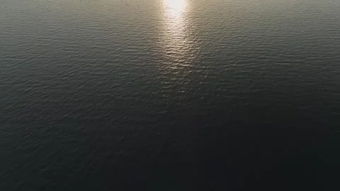 Aerial View: A close-up view of ocean water shows rippling waves and gentle Stock-Footage 296078280