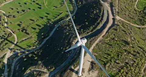Aerial view close-up of a windmill propeller in a beautiful landscape Stock Footage 231072791