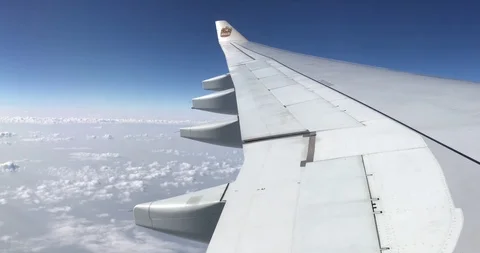 Aerial view cloud and horizontal skyline through an airplane's window. Stock Footage 113767293