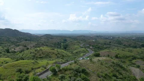 Aerial View of Cloud-Covered Green Mountains Stock Footage 310501436