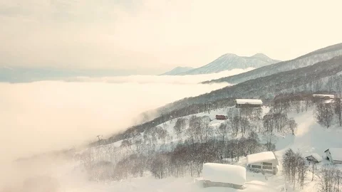 Aerial view of cloud covering snow mountain in Myoko, Niigata, Japan Stock Footage 107264854