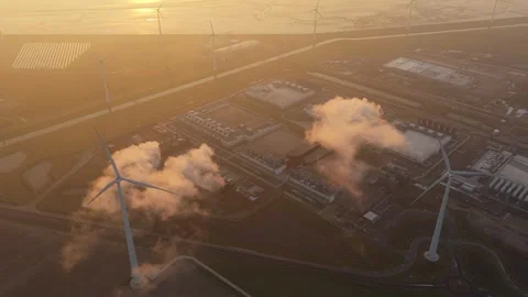 Aerial view of a cloud data center with wind turbines at sunrise Stock Footage 334056641