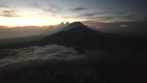 Aerial View: Clouds above Mount Abang and Lake Batur Stock Footage 236310281