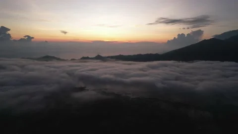 Aerial View: Clouds above Mount Abang and Lake Batur Stock Footage 236673608