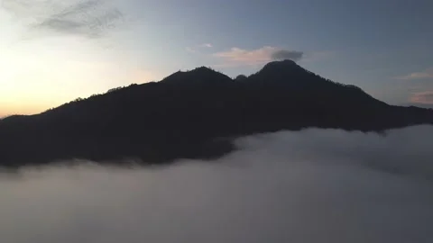 Aerial View: Clouds above Mount Abang and Lake Batur Stockbeeldmateriaal 236677694