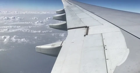Aerial view of clouds, aircraft engine and wing through airplanes windows Video stock 113767268