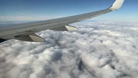 Aerial view of clouds from airplane window Video stock 169613530