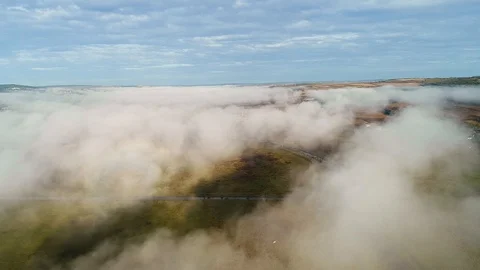Aerial view of clouds and barely visible fields. Stock Footage 113379623