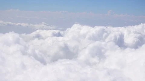 Aerial view of clouds and sky seen from a Plane Stock Footage