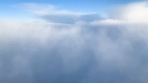 Aerial view of clouds and sky from plane window during flight Stock-Footage 121354781