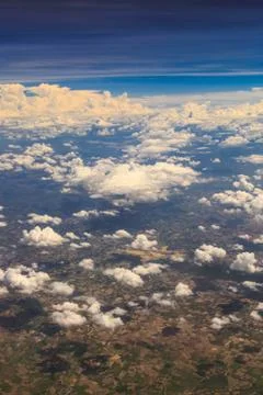 Aerial view of clouds and village Stock Photos