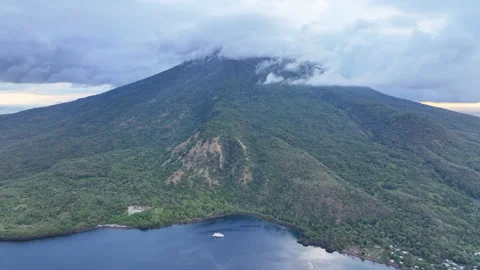 Aerial View of Clouds Drifting Above a Scenic Volcano in Indonesia Stock Footage 279590833