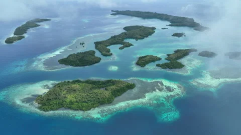 Aerial View of Clouds Drifting Above Amazing Tropical Islands in Halmahera Stock Footage 308984950