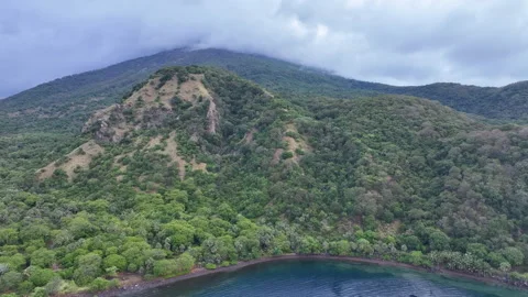 Aerial View of Clouds Drifting Over Scenic Volcano in Lesser Sunda Islands Stock Footage 279579153