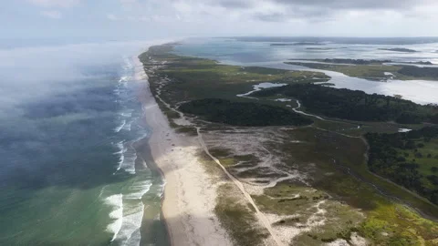 Aerial View of Clouds Drifting Over a Scenic Cape Cod Beach Stock Footage 316836359