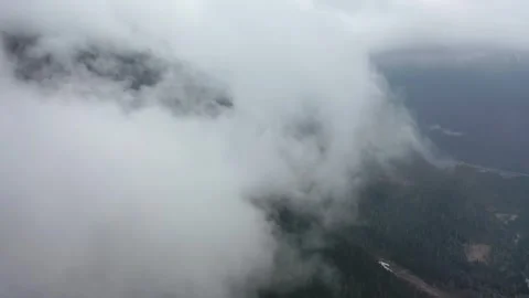Aerial View of Clouds Drifting Over Mountain Ranges in Nyingchi, Tibet Stockbeeldmateriaal 345846429
