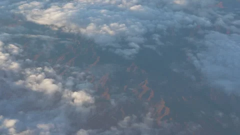Aerial view of clouds flowing over mountains Stock Footage 287028939