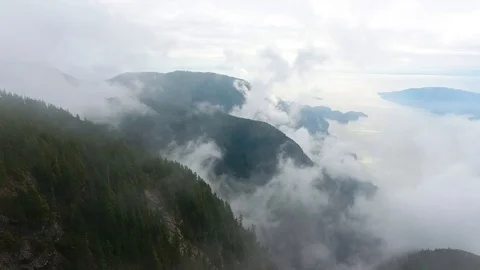 Aerial view of clouds mountains and ocean Vídeo Stock 90680143